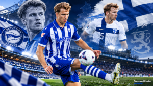 Ville Koski jalkapallokentällä Alavésin sinivalkoisessa peliasussa – taustalla Suomen Huuhkajat, stadion ja jalkapallouran…